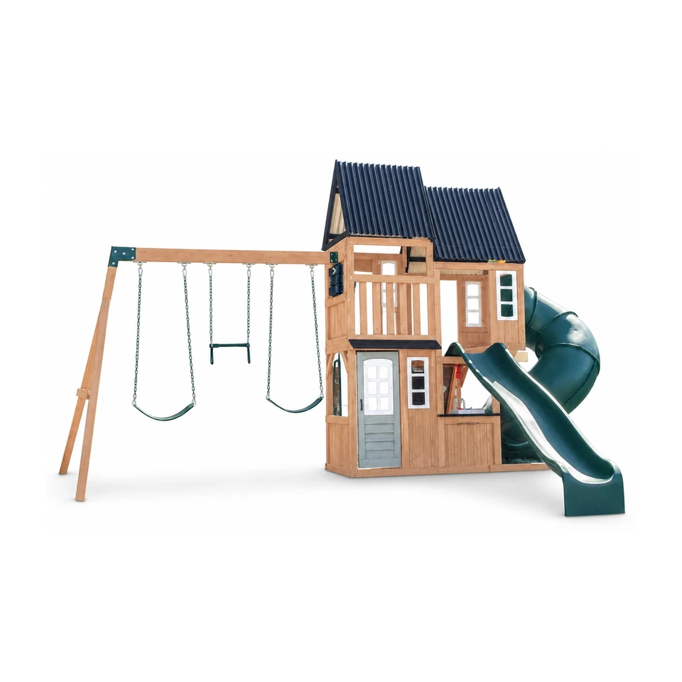 KidKraft Acadia Manor outdoor swing set with two slides and swing bay set up on a green backyard lawn