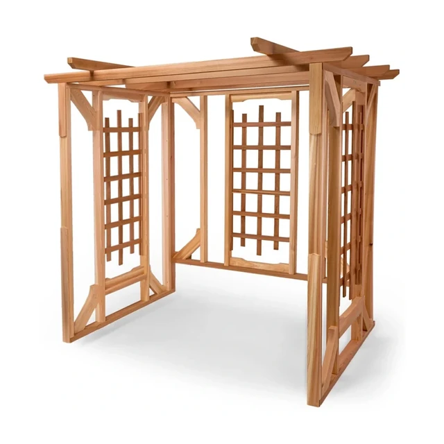 Cedar patio pergola with a hanging swing suspended from the beams on a garden lawn